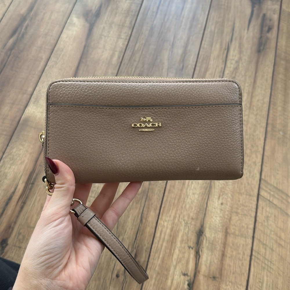 Beige / taupe color Coach wallet with wristlet attachment